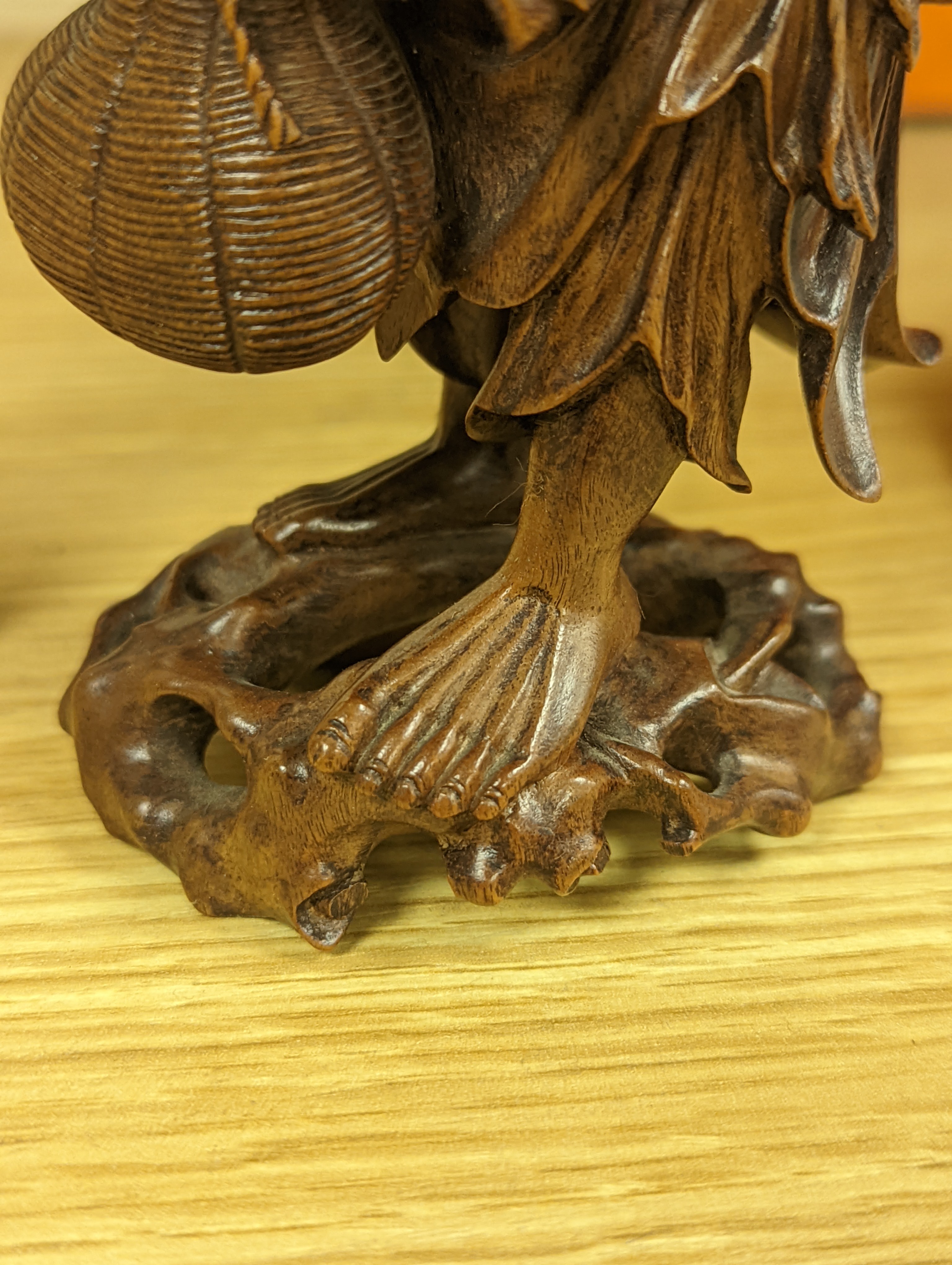 Two Chinese hardwood figures of a fisherman and a old man holding peaches 16cm